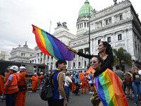 Revelers take part in the 33rd LGBT Pride Parade in Buenos Aires, Argentina, on November 2, 2024. (