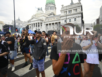 Revelers take part in the 33rd LGBT Pride Parade in Buenos Aires, Argentina, on November 2, 2024. (