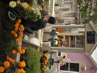 A person decorates the grave of their loved ones with cempasuchil flowers at the Municipal Cemetery of San Juan del Rio. Mexicans visit the...