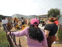 People decorate the graves of their loved ones with cempasuchil flowers at the Municipal Cemetery of San Juan del Rio. Mexicans visit the ce...