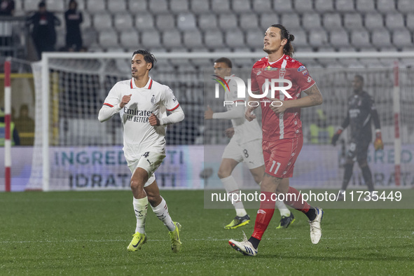 Milan Djuric and Tijjani Reijnders play during the Serie A match between AC Monza and AC Milan at U-Power Stadium in Monza, Italy, on Novemb...