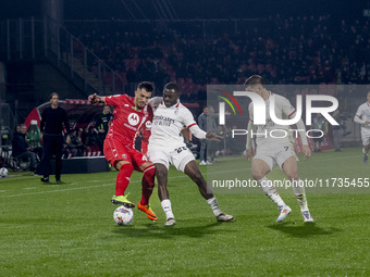 Dany Mota and Youssouf Fofana are in action during the Serie A match between AC Monza and AC Milan in Monza, Italy, on November 2, 2024, at...