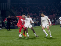 Dany Mota and Youssouf Fofana are in action during the Serie A match between AC Monza and AC Milan in Monza, Italy, on November 2, 2024, at...