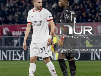 Strahinja Pavlovic and Mike Maignan are in action during the Serie A match between AC Monza and AC Milan at U-Power Stadium in Monza, Italy,...