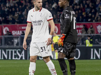 Strahinja Pavlovic and Mike Maignan are in action during the Serie A match between AC Monza and AC Milan at U-Power Stadium in Monza, Italy,...