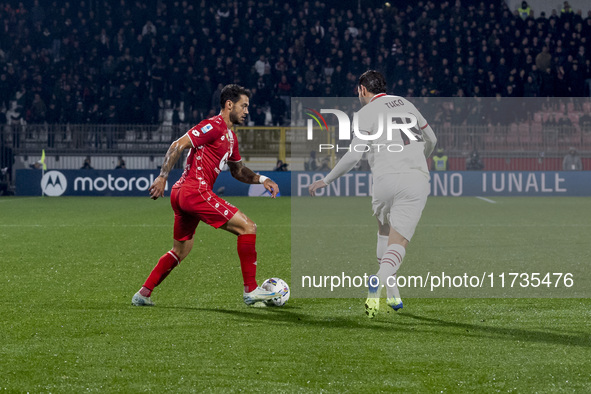 Pedro Pereira and Theo Hernandez play during the Serie A match between AC Monza and AC Milan at U-Power Stadium in Monza, Italy, on November...