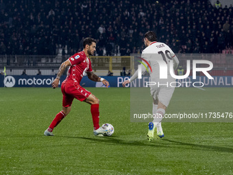 Pedro Pereira and Theo Hernandez play during the Serie A match between AC Monza and AC Milan at U-Power Stadium in Monza, Italy, on November...