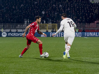 Pedro Pereira and Theo Hernandez play during the Serie A match between AC Monza and AC Milan at U-Power Stadium in Monza, Italy, on November...