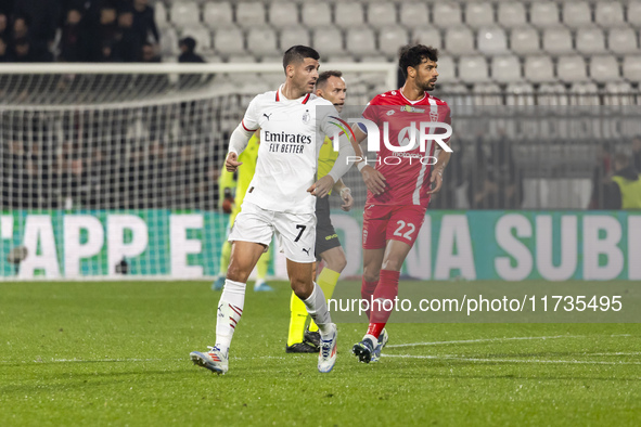 Alvaro Morata and Pablo Mari are in action during the Serie A match between AC Monza and AC Milan at U-Power Stadium in Monza, Italy, on Nov...