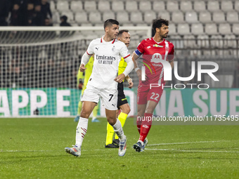 Alvaro Morata and Pablo Mari are in action during the Serie A match between AC Monza and AC Milan at U-Power Stadium in Monza, Italy, on Nov...