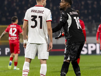 Strahinja Pavlovic and Mike Maignan are in action during the Serie A match between AC Monza and AC Milan at U-Power Stadium in Monza, Italy,...