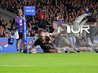 Mark Tele'a of New Zealand scores the winning try during the Autumn Nations Series International Rugby match between England and New Zealand...