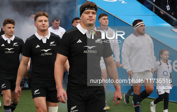 From left to right, Beauden Barrett of New Zealand, Jordie Barrett of New Zealand, and Scott Barrett of New Zealand (brothers) participate i...