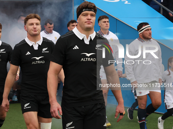 From left to right, Beauden Barrett of New Zealand, Jordie Barrett of New Zealand, and Scott Barrett of New Zealand (brothers) participate i...