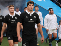 From left to right, Beauden Barrett of New Zealand, Jordie Barrett of New Zealand, and Scott Barrett of New Zealand (brothers) participate i...