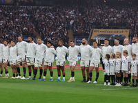 The England team stands before kickoff during the Autumn Nations Series International Rugby match between England and New Zealand at Allianz...