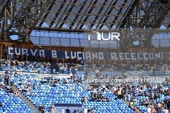 Supporters of S.S.C. Napoli attend the 11th day of the Serie A Championship between S.S.C. Napoli and Atalanta B.C. at the Diego Armando Mar...