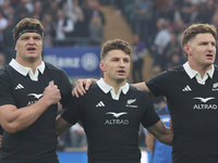 From left to right, Scott Barrett of New Zealand, Beauden Barrett of New Zealand, and Jordie Barrett of New Zealand (brothers) stand before...