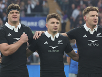 From left to right, Scott Barrett of New Zealand, Beauden Barrett of New Zealand, and Jordie Barrett of New Zealand (brothers) stand before...