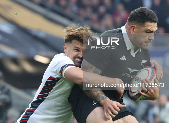 L-R: England's Henry Slade (Exeter Chiefs) tackles Tamaiti Williams of New Zealand during the Autumn Nations Series International Rugby matc...