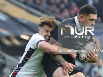 L-R: England's Henry Slade (Exeter Chiefs) tackles Tamaiti Williams of New Zealand during the Autumn Nations Series International Rugby matc...