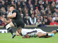 England's Ollie Lawrence (Bath Rugby) tackles Jordie Barrett of New Zealand during the Autumn Nations Series International Rugby match betwe...