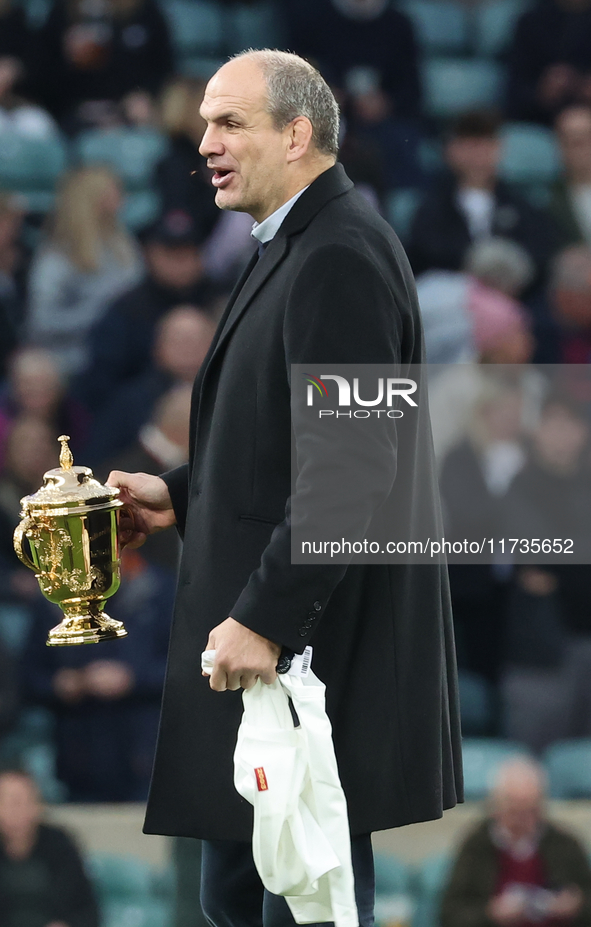 Martin Johnson, former England player, holds the World Cup at halftime during the Autumn Nations Series International Rugby match between En...