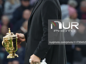 Martin Johnson, former England player, holds the World Cup at halftime during the Autumn Nations Series International Rugby match between En...