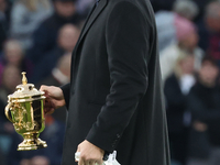 Martin Johnson, former England player, holds the World Cup at halftime during the Autumn Nations Series International Rugby match between En...