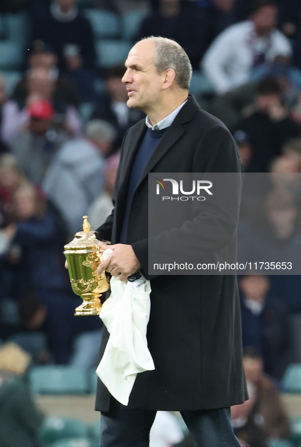 Martin Johnson, former England player, holds the World Cup at halftime during the Autumn Nations Series International Rugby match between En...