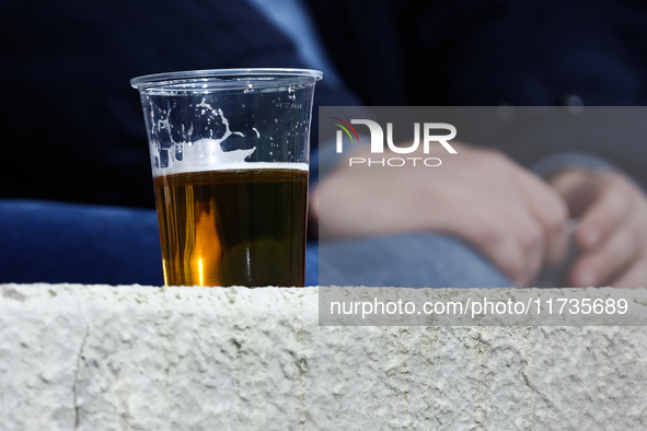 A plastic cup of beer is seen during Puszcza Niepolomice - Lech Poznan match of the Ekstraklasa Polish Football League, at Cracovia Stadium...