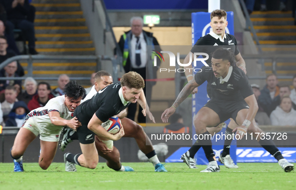 Jordie Barrett of New Zealand is tackled by England's Marcus Smith (Harlequins) during the Autumn Nations Series International Rugby match b...