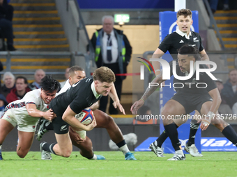 Jordie Barrett of New Zealand is tackled by England's Marcus Smith (Harlequins) during the Autumn Nations Series International Rugby match b...