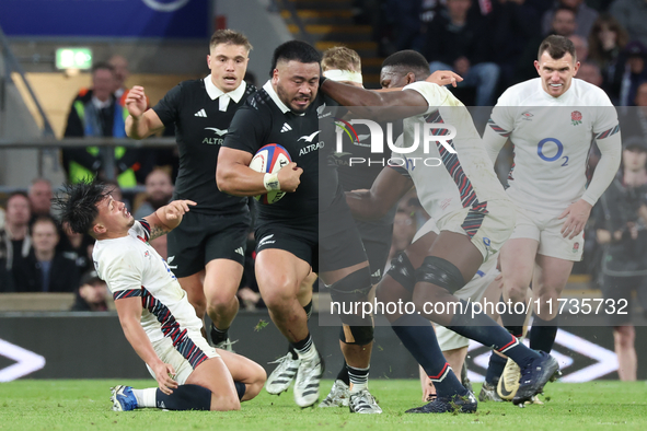 Asafo Aumua of New Zealand is tackled by England's Maro Itoje (Saracens) during the Autumn Nations Series International Rugby match between...