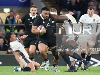 Asafo Aumua of New Zealand is tackled by England's Maro Itoje (Saracens) during the Autumn Nations Series International Rugby match between...