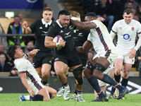 Asafo Aumua of New Zealand is tackled by England's Maro Itoje (Saracens) during the Autumn Nations Series International Rugby match between...