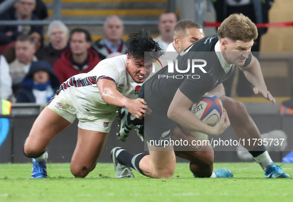 Jordie Barrett of New Zealand is tackled by England's Marcus Smith (Harlequins) during the Autumn Nations Series International Rugby match b...