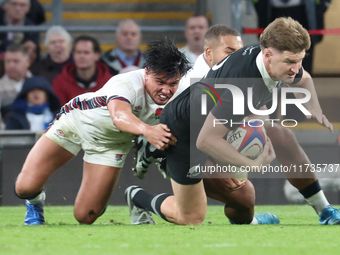 Jordie Barrett of New Zealand is tackled by England's Marcus Smith (Harlequins) during the Autumn Nations Series International Rugby match b...