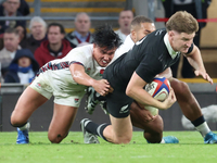 Jordie Barrett of New Zealand is tackled by England's Marcus Smith (Harlequins) during the Autumn Nations Series International Rugby match b...