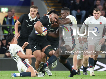 Asafo Aumua of New Zealand is tackled by England's Maro Itoje (Saracens) during the Autumn Nations Series International Rugby match between...