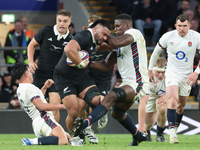 Asafo Aumua of New Zealand is tackled by England's Maro Itoje (Saracens) during the Autumn Nations Series International Rugby match between...