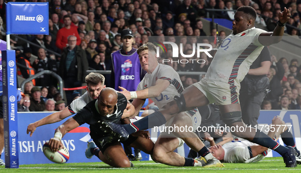 Mark Tele'a of New Zealand scores his try during the Autumn Nations Series International Rugby match between England and New Zealand at Alli...