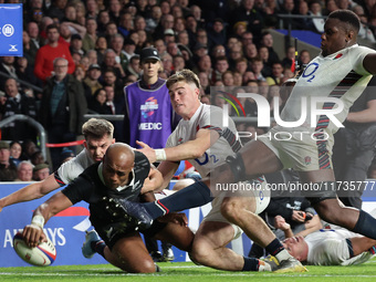 Mark Tele'a of New Zealand scores his try during the Autumn Nations Series International Rugby match between England and New Zealand at Alli...