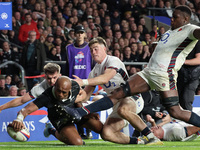 Mark Tele'a of New Zealand scores his try during the Autumn Nations Series International Rugby match between England and New Zealand at Alli...