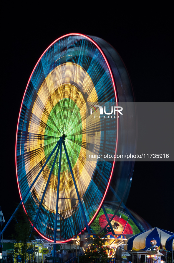 A long exposure captures a Ferris wheel in Orlando, Florida, USA. 