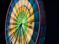 A long exposure captures a Ferris wheel in Orlando, Florida, USA. (