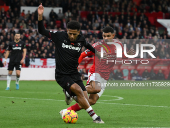 Jean-Clair Todibo of West Ham United is under pressure from Morgan Gibbs-White of Nottingham Forest during the Premier League match between...