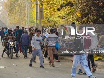 Civilians walk near the site of a grenade blast at a marketplace in Srinagar, Jammu and Kashmir, on November 3, 2024. At least ten people ar...