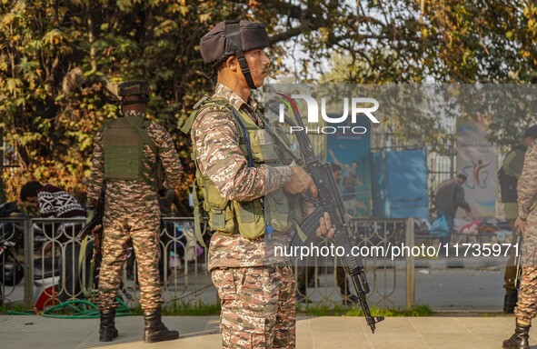 Indian security personnel stand near the site of a grenade blast at a marketplace in Srinagar, Jammu and Kashmir, on November 3, 2024. At le...