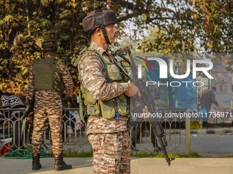 Indian security personnel stand near the site of a grenade blast at a marketplace in Srinagar, Jammu and Kashmir, on November 3, 2024. At le...